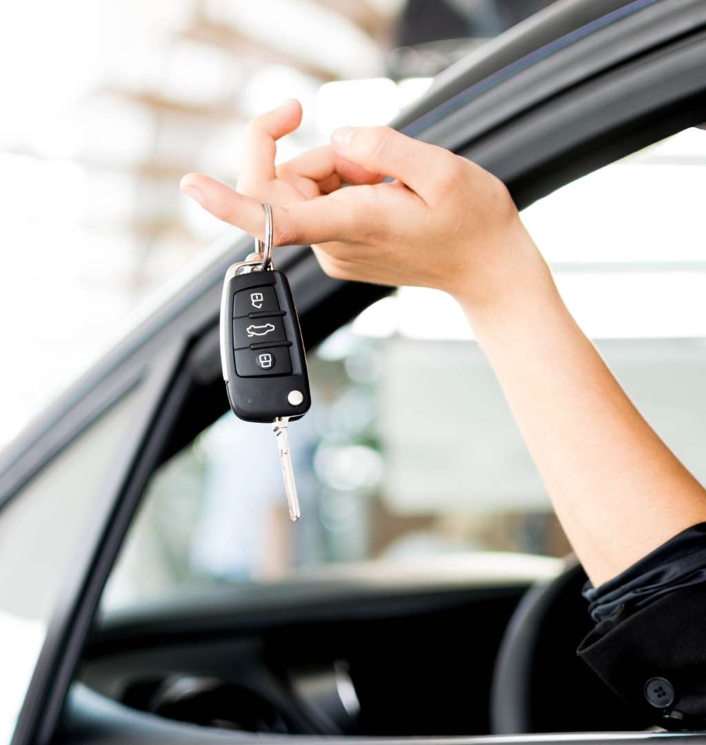 A Person Holding A Car Key