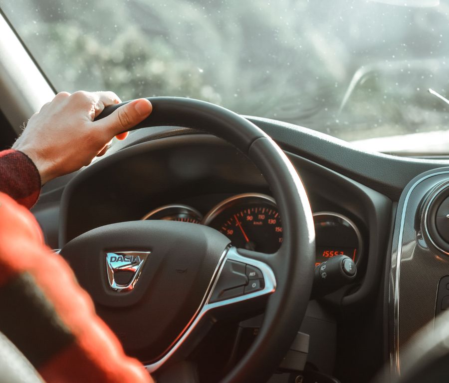  A Person Holding A Steering Wheel 